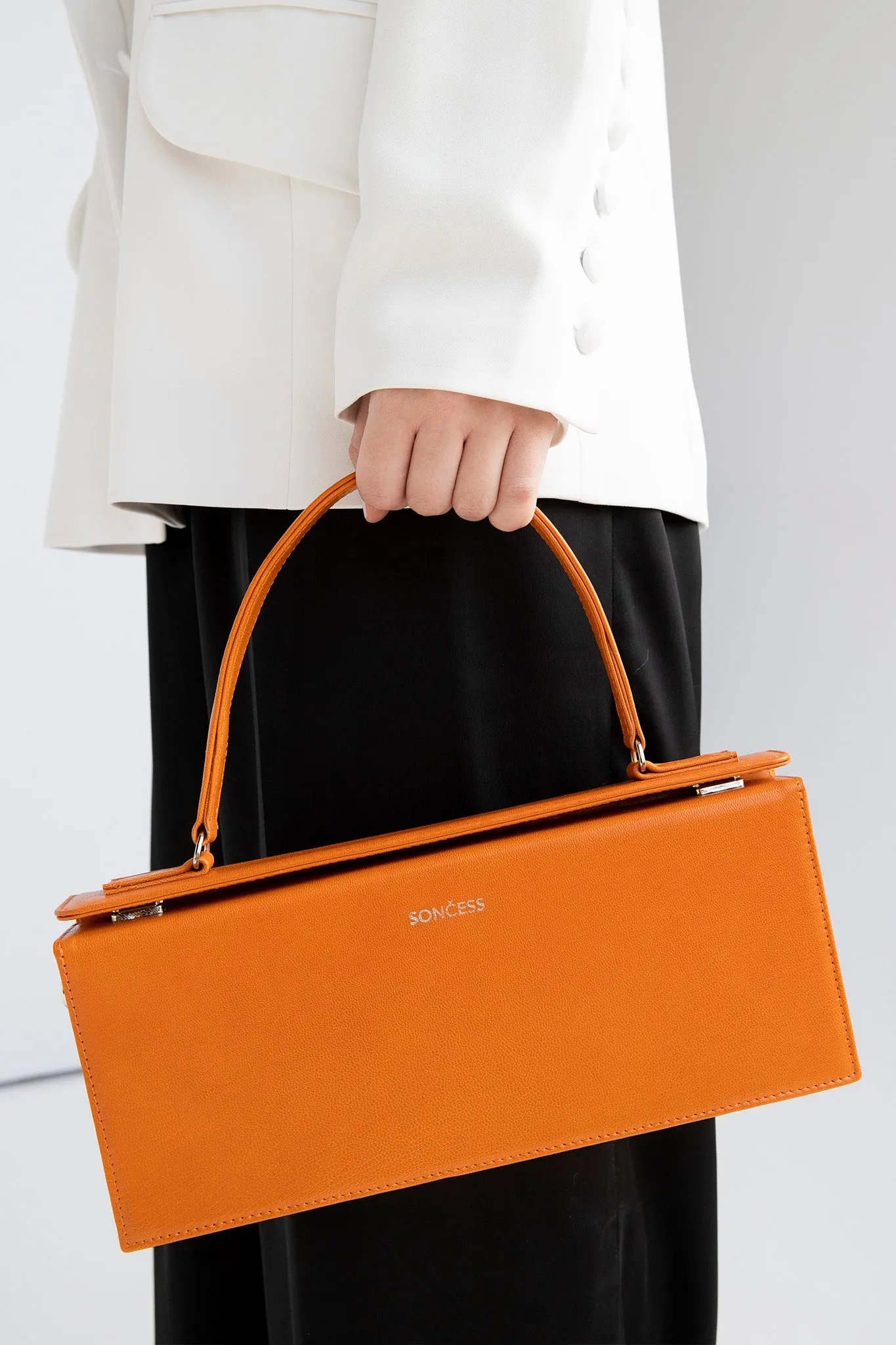 Structured rectangle shoulder bag in orange